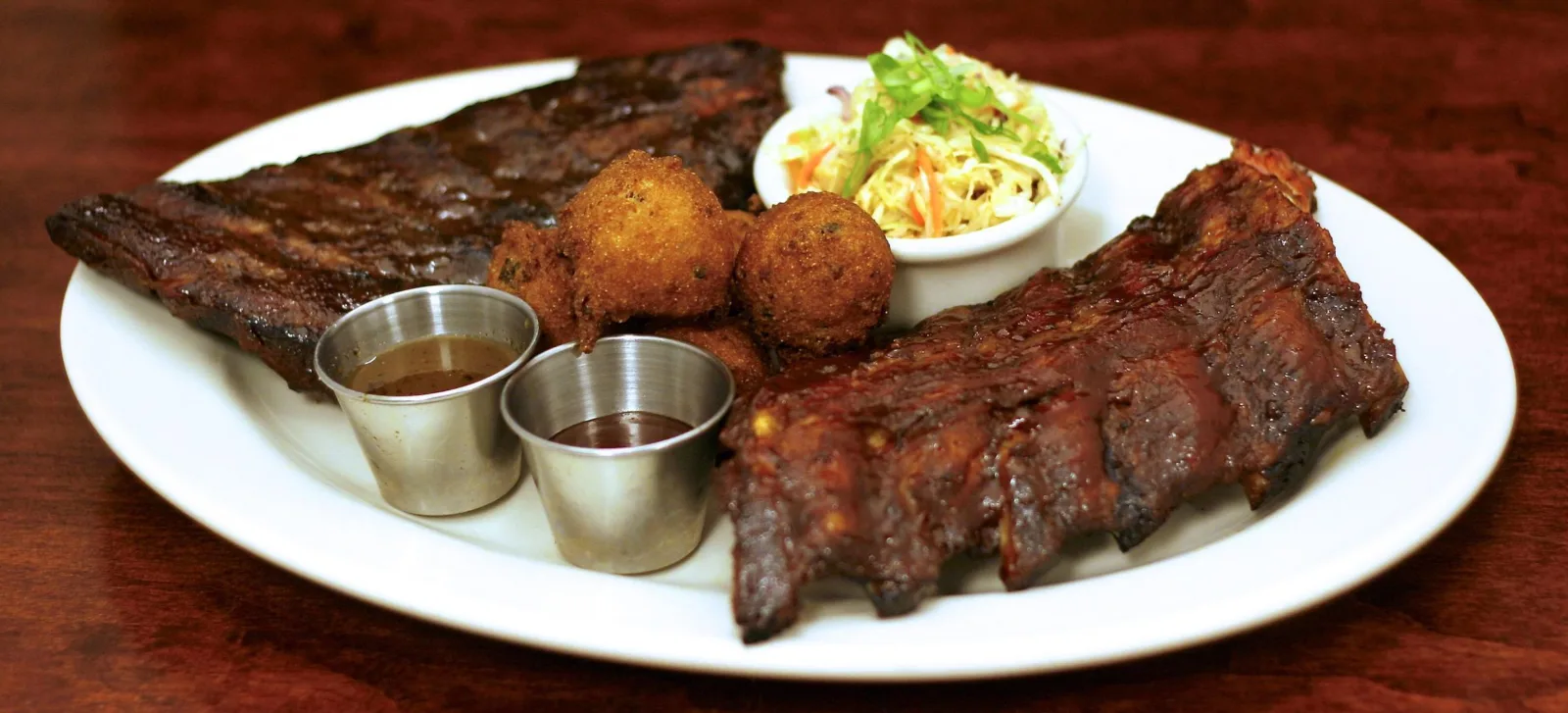 Weber Grill Restaurant Dueling Ribs Image for Surprise Dad with Tableside Steaks this Father’s Day at Weber Grill Restaurants