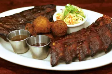 Weber Grill Restaurant Dueling Ribs Image for Surprise Dad with Tableside Steaks this Father’s Day at Weber Grill Restaurants