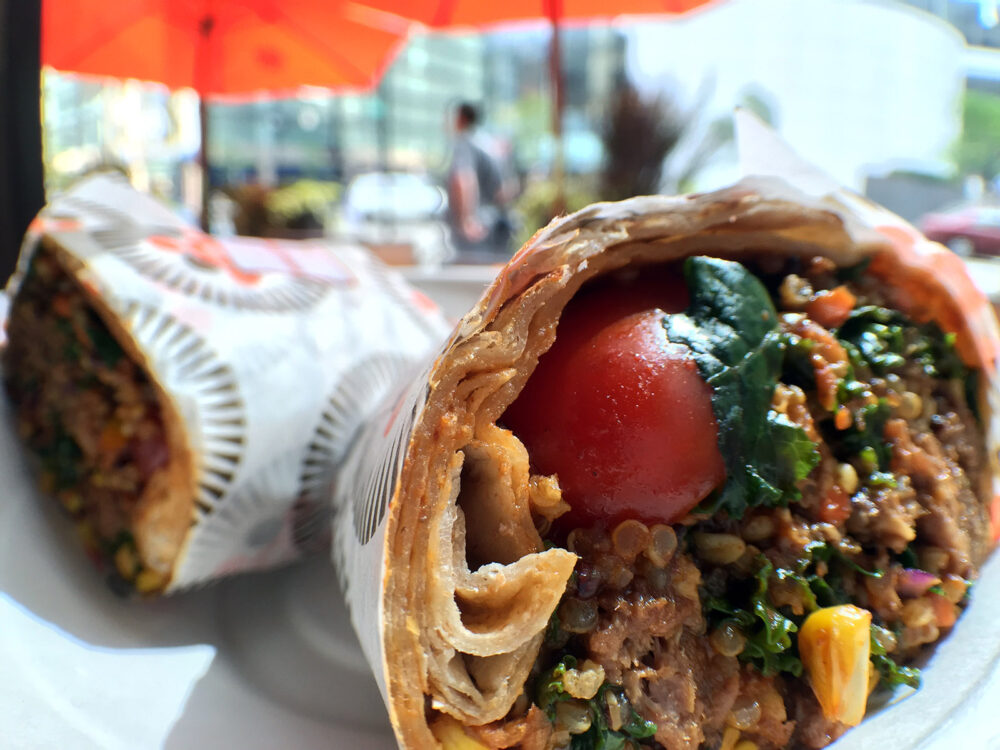 Braised barbecue beef, organic quinoa blend, roasted corn, kale slaw, grape tomatoes, radishes, and housemade Agave BBQ Sauce for Protein Bar Offers Healthy BBQ Anytime