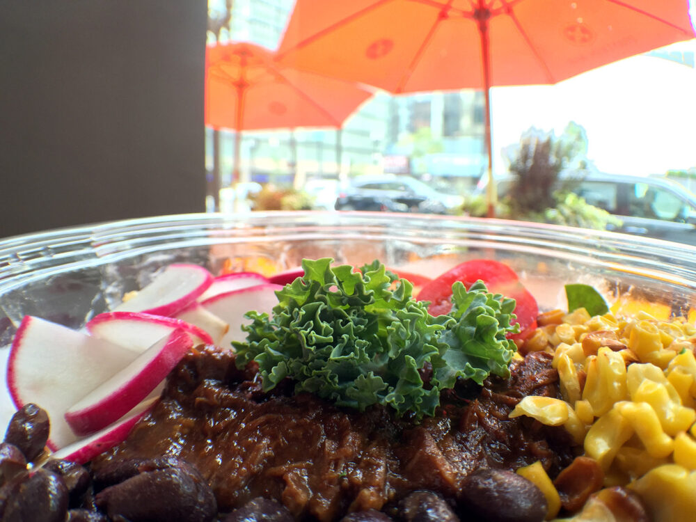 Braised barbecue beef, roasted corn, seasoned black beans, radishes, grape tomatoes, with Greek yogurt ranch dressing for Protein Bar Offers Healthy BBQ Anytime