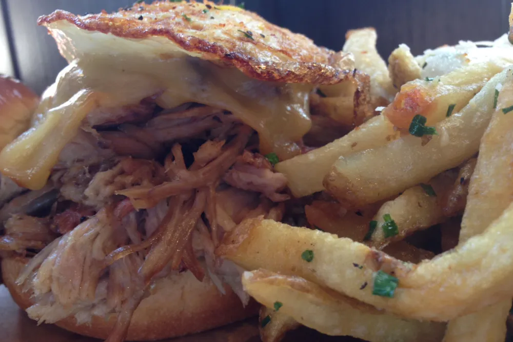 Pulled Pork Sandwich with Gouda. Photo credit: Kat Levitt @agirlandherfood for Brunch and Barbeque: Q BBQ Shows You How to Do It