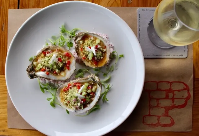 Hearth Grilled Oysters at The Promontory for National Oyster Day Specials at Chicago Hot Spots