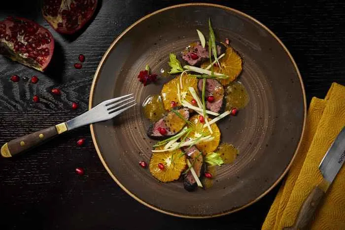 Spice Rubbed Lamb Loin Grilled Orange Green Apple Green Onions Apple Cider Vinaigrette for Halloween Celebration at Artango
