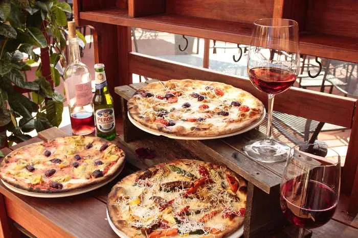 Pizza On Stand In Patio for Guns N' Roses Menu at Macello