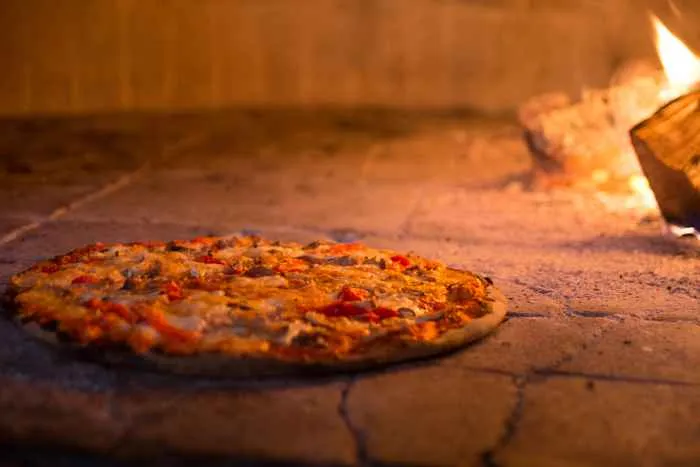 Pair half price wine with award winning pizza at Macello for Black Wednesday Dining and Drink Specials