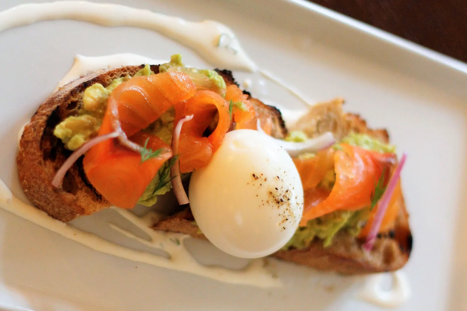 Hearth Brunch 0000 Salmon And Avocado Toast With Creme Fraiche And Soft Boiled Egg for Hearth at The Homestead Hosts Easter Brunch