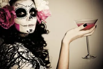 Stock Photo A Woman In Halloween Costume Holding A Glass With Red Liquid 93416938 for Halloween Celebrations in Chicagoland