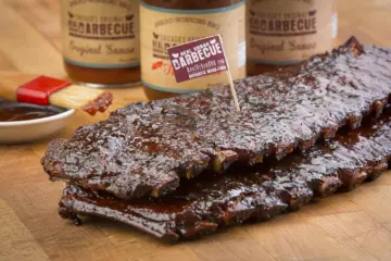 Racks Of Ribs Sauce In Background for Eat Your Feelings This Valentine's Day at Real Urban BBQ