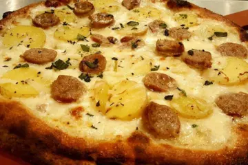 Bangers And Mash Pizza for St. Patrick’s Day & Pi Day this March at SLYCE Coal Fired Pizza