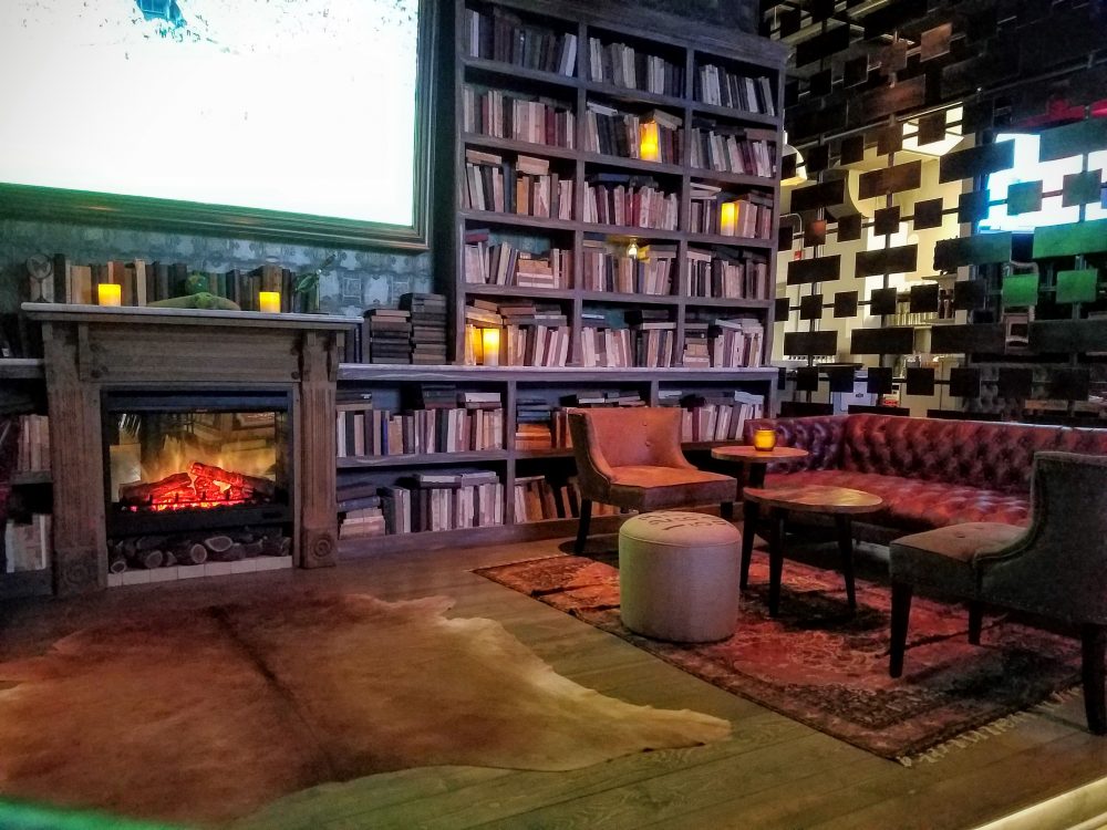 The cozy library perfect for sipping whiskey in front of the faux fire and very real large screen TV.