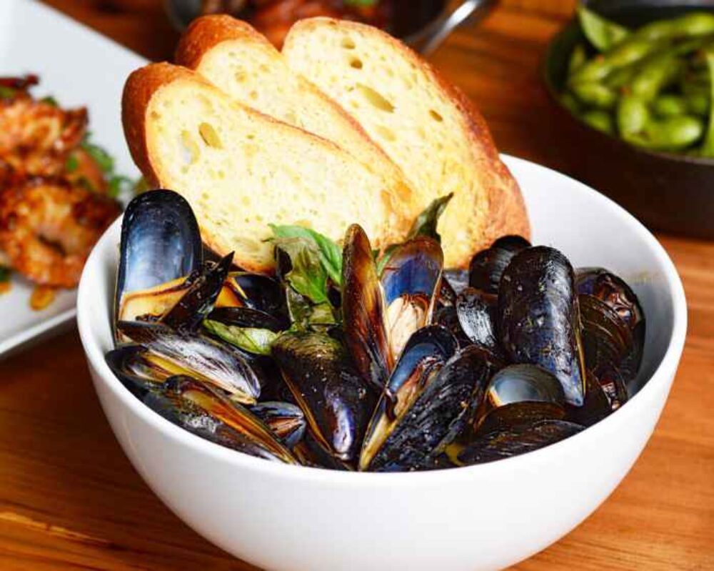 Happy Hour specials include delicious basil cream mussels at Bites for Black Wednesday Dining and Drink Specials