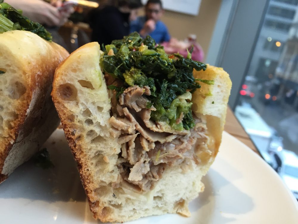 roasted pork and rapini on baguette