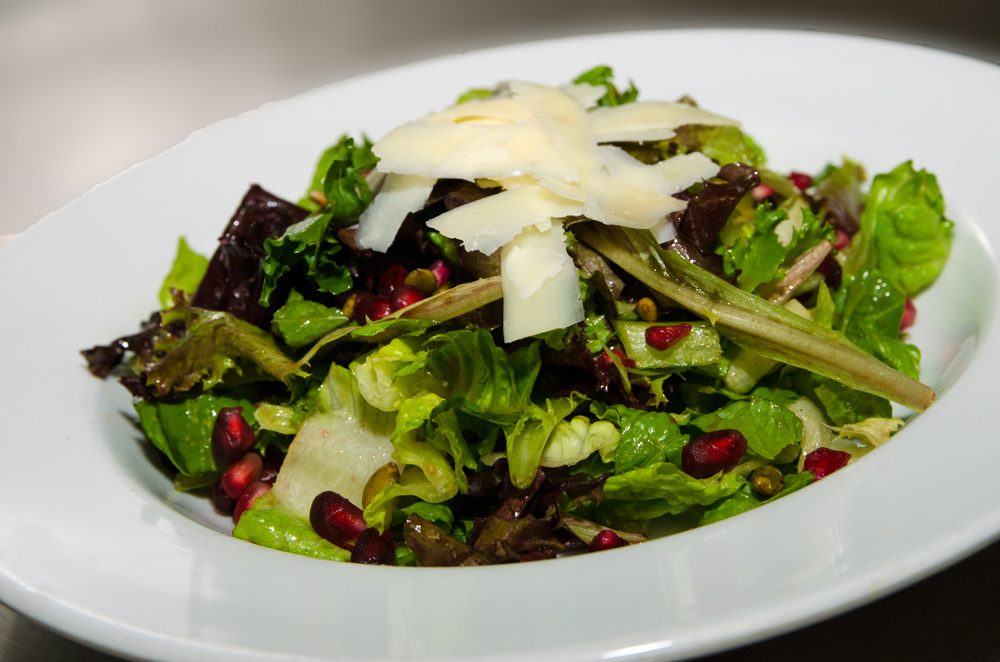 Mixed Green Salad with Apples, Pomegranate Seeds, Pumpkin Seeds, and Balsamic Vinaigrette. Photo credit: Cindy Kurman