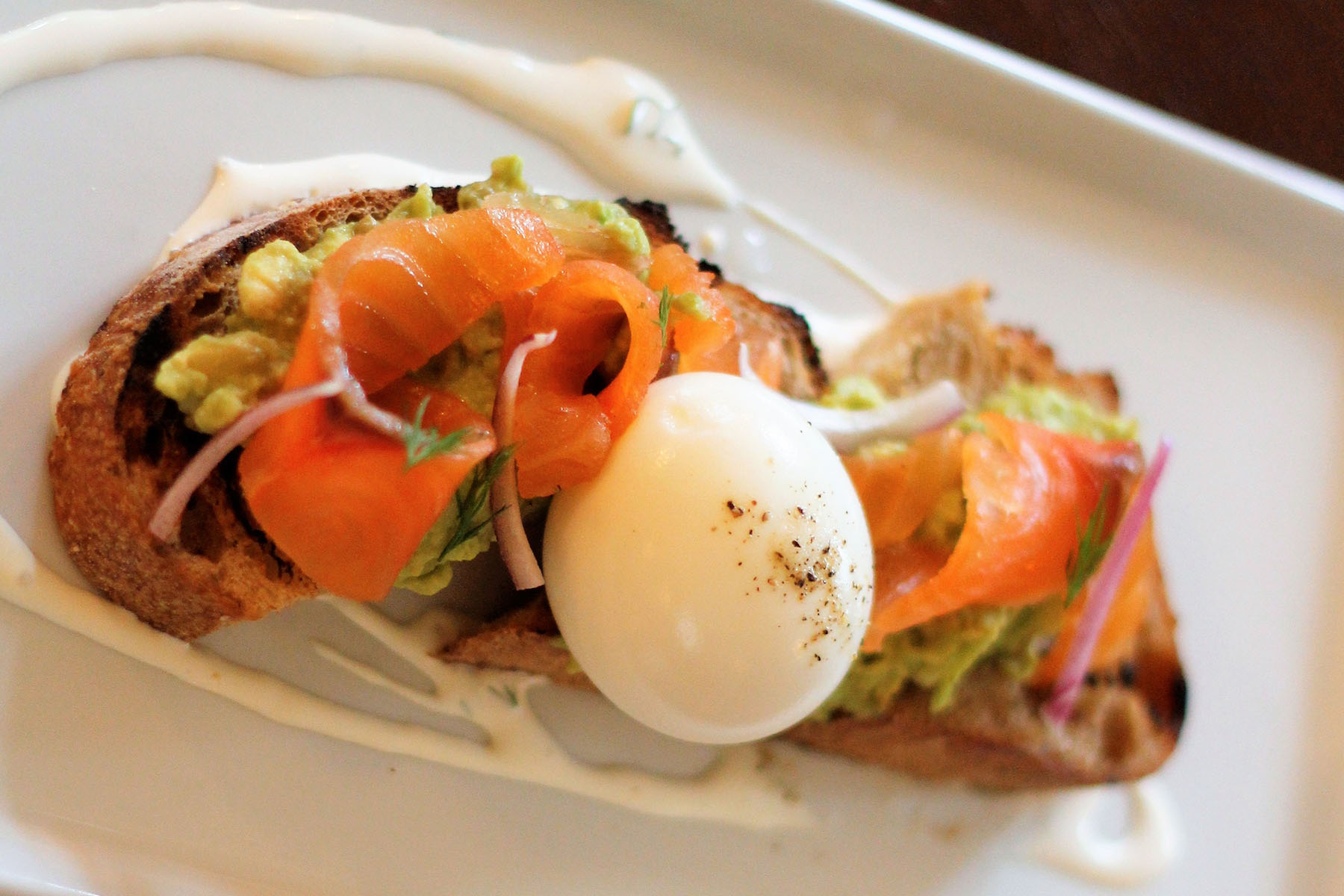 Hearth Brunch 0000 Salmon And Avocado Toast With Creme Fraiche And Soft Boiled Egg for Hearth at The Homestead Hosts Easter Brunch