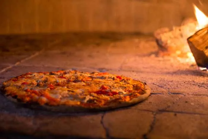 Pizza Americana In Oven for Pre Bulls Game Prix Fixe at Macello
