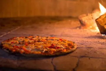 Pizza Americana In Oven for Pre Bulls Game Prix Fixe at Macello
