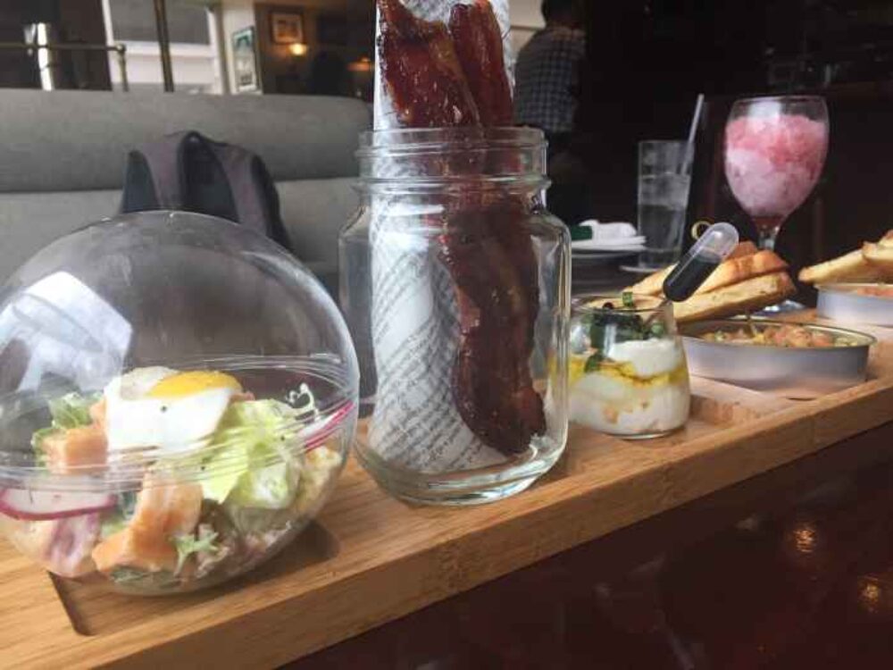 Appetizer Sampler with Smoked Salmon Tartar, Ricotta and Goat Cheese, Bourbon Candied Bacon and House Farm Salad for Sláinte! to Kitty O’Sheas New Summer Menu