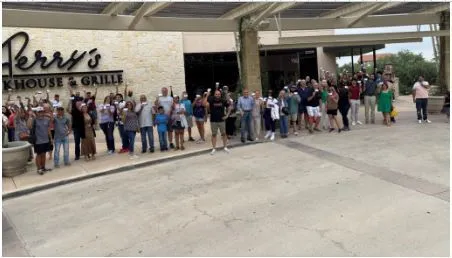 Guests waiting in line for Pork Chop Friday lunch