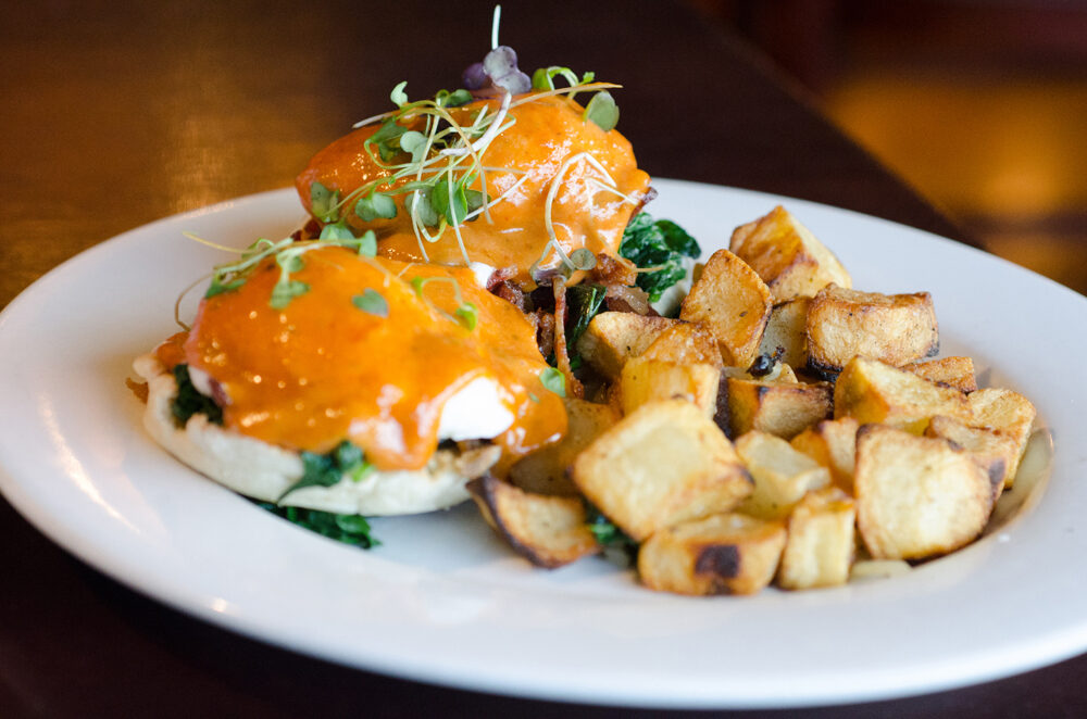 Start with the Signature Benedict Poached Egg, Spinach, Roasted Tomato Hollandaise