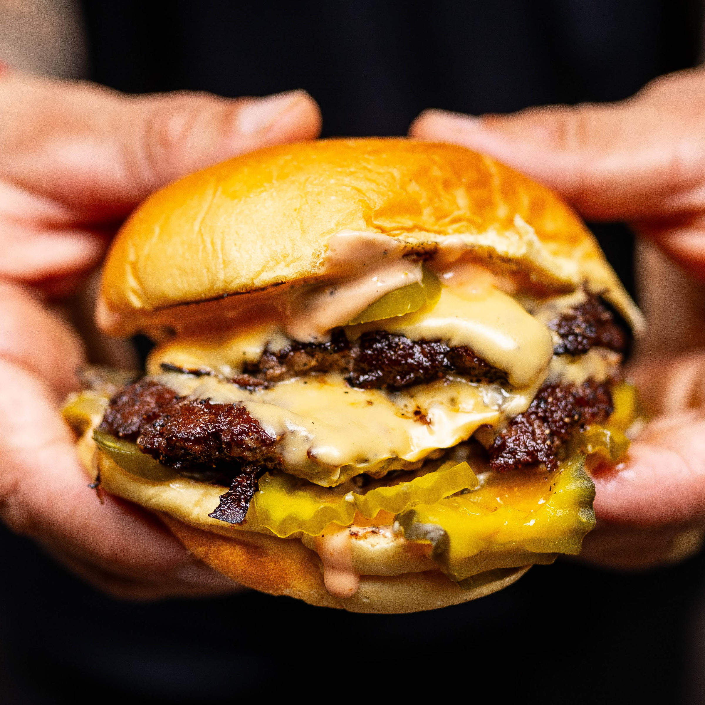Close Up Nadc Burger for Michelin star Chef and Pro Skateboarder Bring a Second NADC Burger Location to Chicago