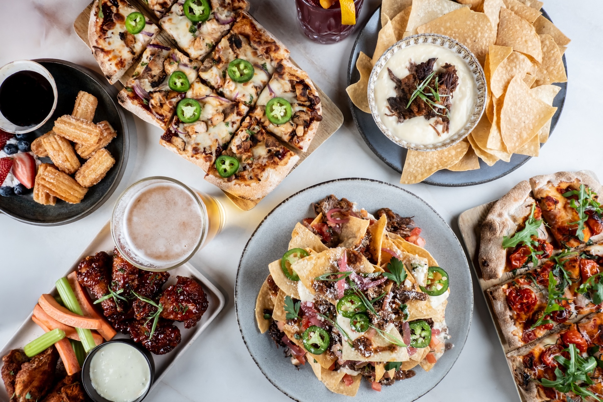Puttshack New Menu HERO IMAGE Multi Plate for Puttshack in Skokie and Oakbrook Unveils Refreshed Menu, Offering 50+ New Food and Beverage Options