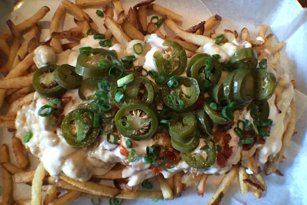 Fries, sausage gravy and cheese? Sign us up. for Links Taproom Launches Brunch; Craft Beer and Sausage Fans Rejoice