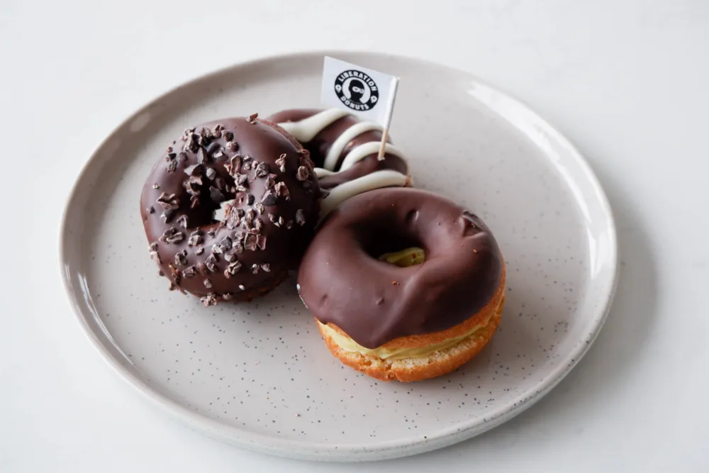 Counter clockwise from left: Bolt Cutter, It's Me Sesame, and Lydia's Eclair for We Ate All the Donuts at Liberation Donuts and Have the Pics to Prove It