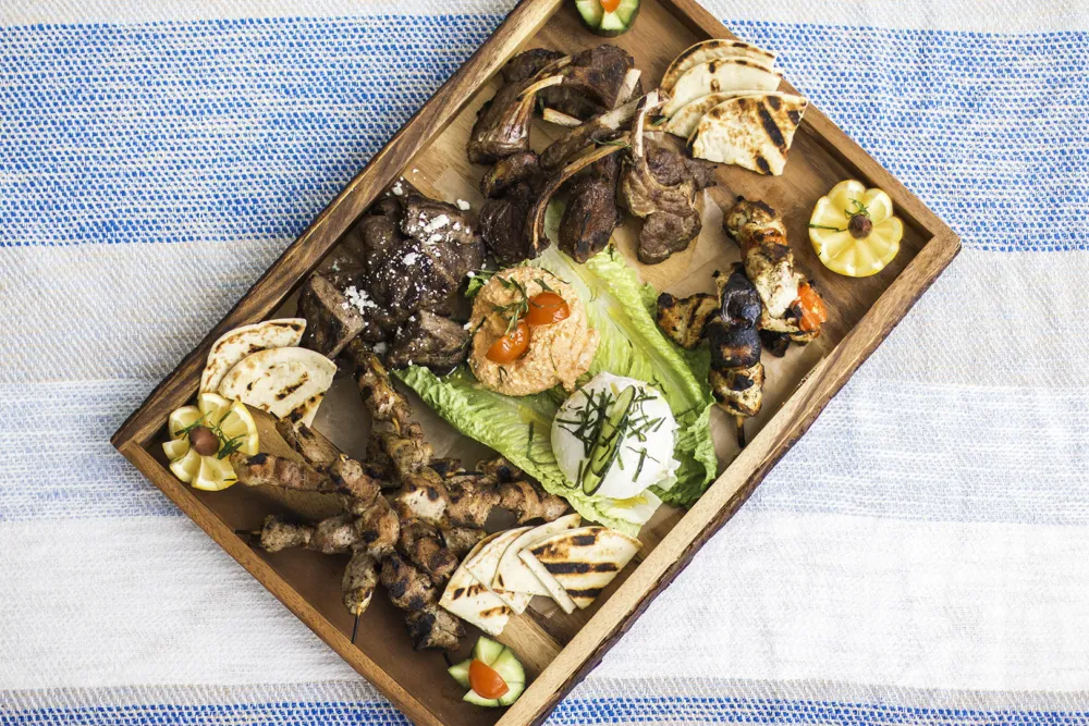 Tsiknopempti is part of the traditional celebrations of Apókries, the Greek Carnival season that centers around large amounts of grilled and roasted meats. (Photo courtesy of Avli Taverna) for What to do in March: Lenten Dining, March Madness, St. Patrick's Day and More!