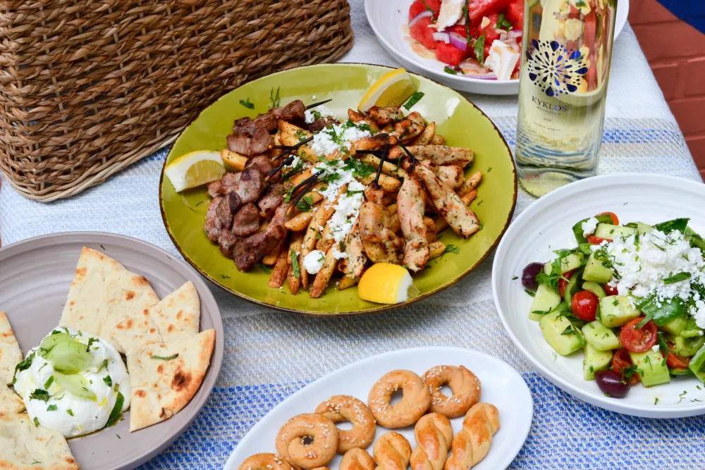 Avli, Chicago’s contemporary Greek dining group, will launch their seasonal picnic basket meals to go on National Picnic Day, April 23rd. (Photo courtesy of Avli) for April Showers Bring Fun Food Events to the Calendar