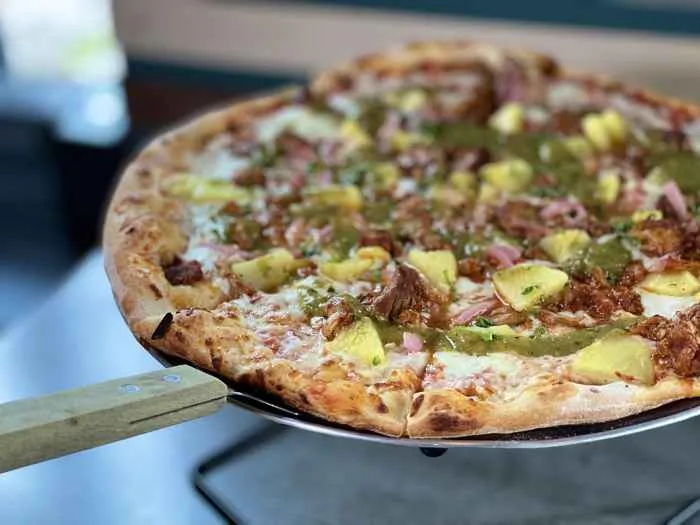 Rewired Pizza Cafe & Bar in Edgewater will offer a “Dad’s Best Friend” pizza and beer specials this Father’s Day. (Photo courtesy of Rewired Pizza Cafe) for Father's Day Dining, Gifts & Specials in Chicagoland