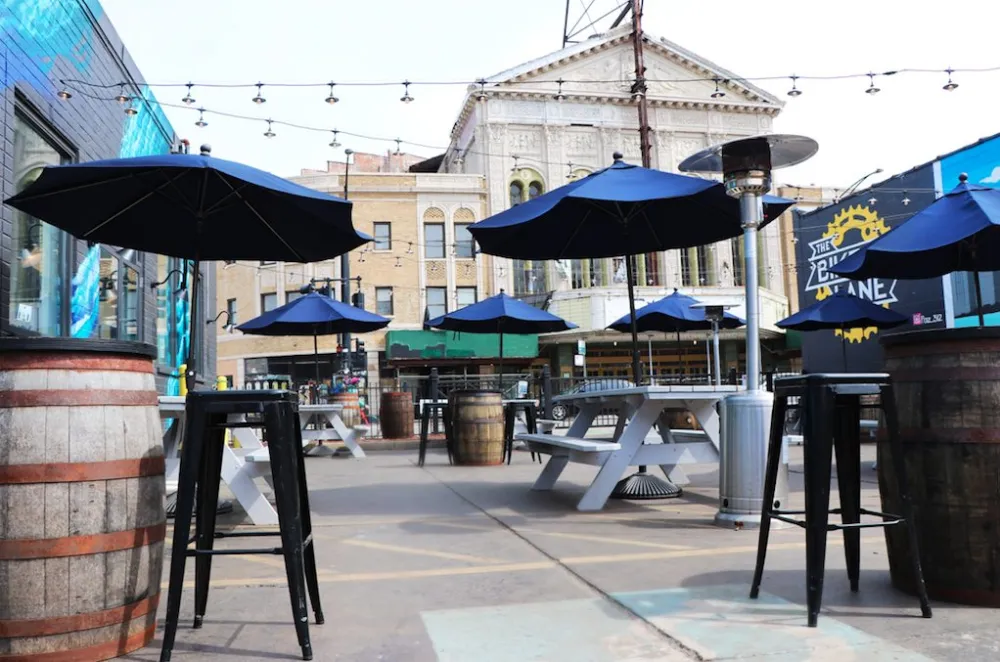 Pilot Project has a 4000 sq ft patio, clad with graffiti from local street artists and overlooks the Congress Theater & Milwaukee Avenue. (Photo courtesy of Pilot Project) for Where to Enjoy Outdoor Dining for Chicago Patio Season