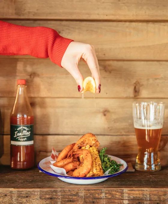 This Labor Day, Ina Mae Tavern & Packaged Goods (1415 N. Wood St) will be celebrating with a Shrimp Boil. (Photo courtesy of Ina Mae Tavern & Packaged Goods) for Labor Day Weekend Specials & Events at Chicago Restaurants
