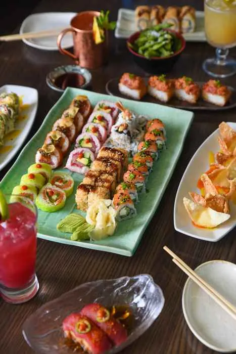 Blue Sushi Happy Hour Spread including the Hot Popper and Crunchy Blue Maki (Photo courtesy of Blue Sushi Sake Grill) for Into the Blue (Sushi Sake Grill)