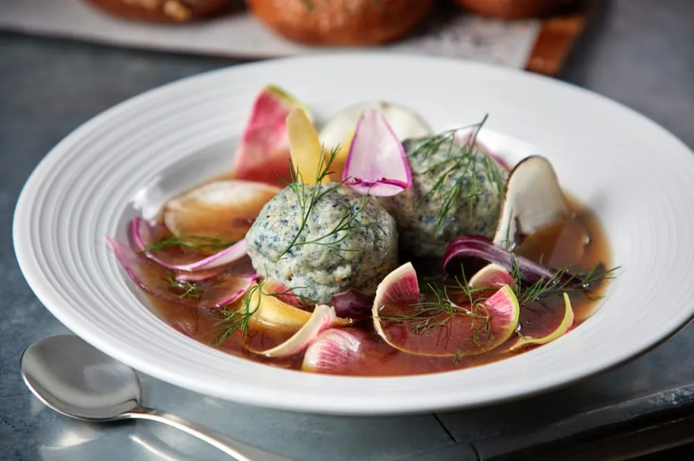 The Matzo Ball Soup at Rye Deli + Drink (Photo courtesy of Neil Burger) for Warm Up this Winter with Seasonal Dishes and Cocktails Around Chicago