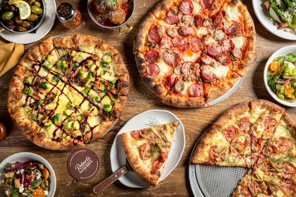 Roberts Pizza Group Shot for Where To Celebrate National Pizza Month in Chicago