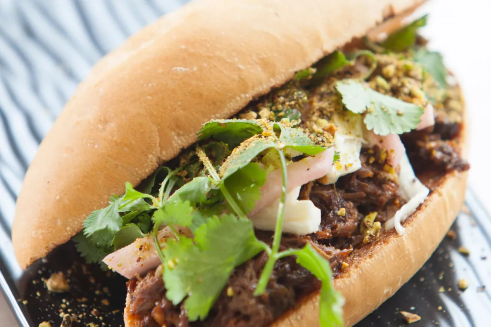 Lamb Barbacoa Torta for Bar Takito Launches Weekend Late Night Menu