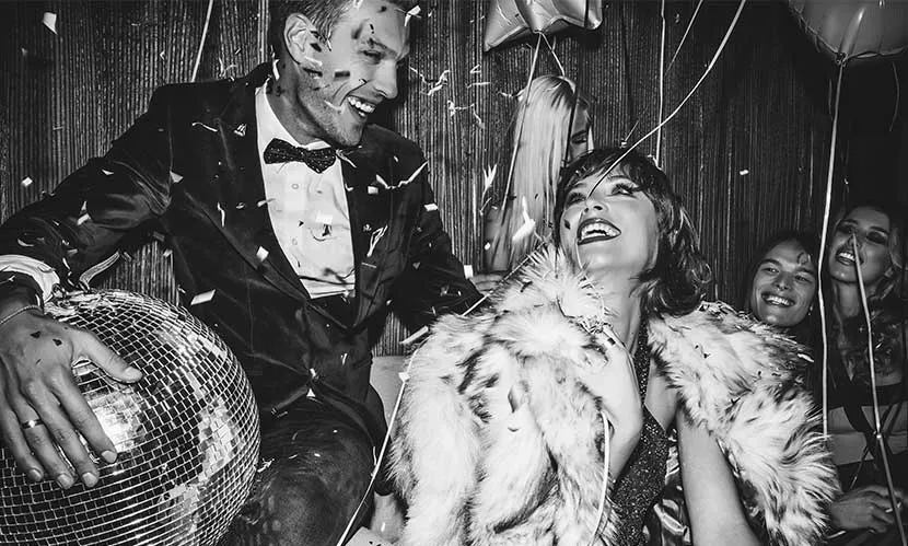 NYE Couple with disco ball for The Art Of Celebration