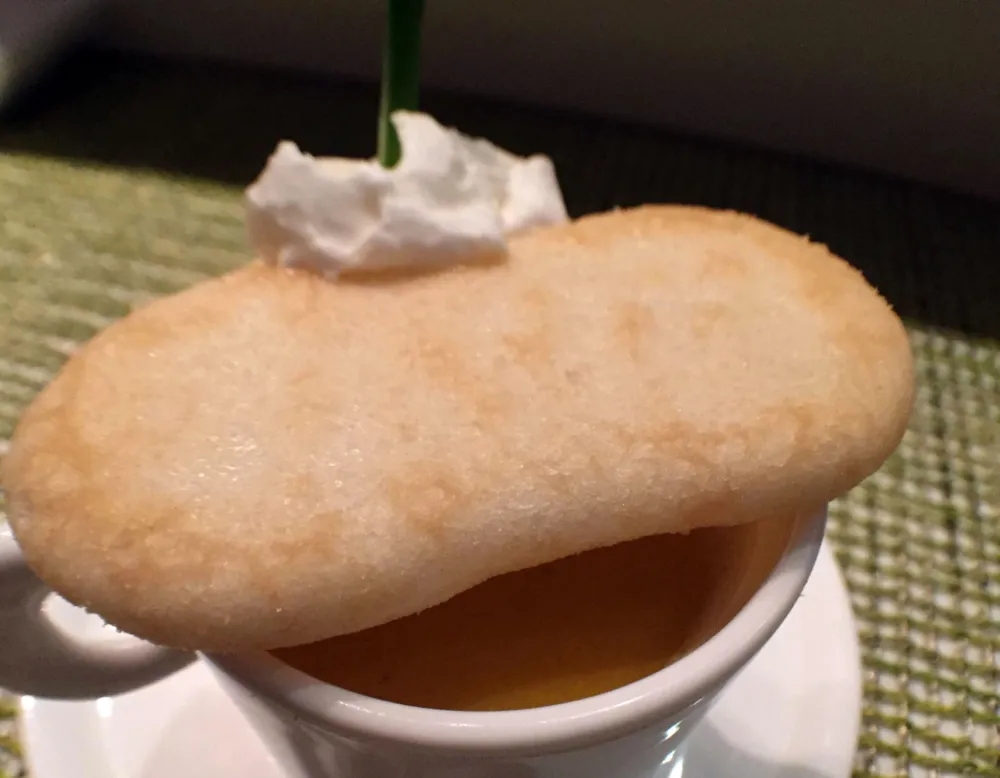 Carrot soup with puréed carrot, alaskan king crab, white miso, cream, chives and rice cracker for Macku Sushi Offers Instagram Worthy Presentations in an Intimate Environment