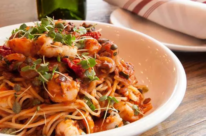 March Noodle Month Capellini Puttanesca with tomato caper olive rock shrimp langostinos and bottarga 02 for National Noodle Month at Tesori