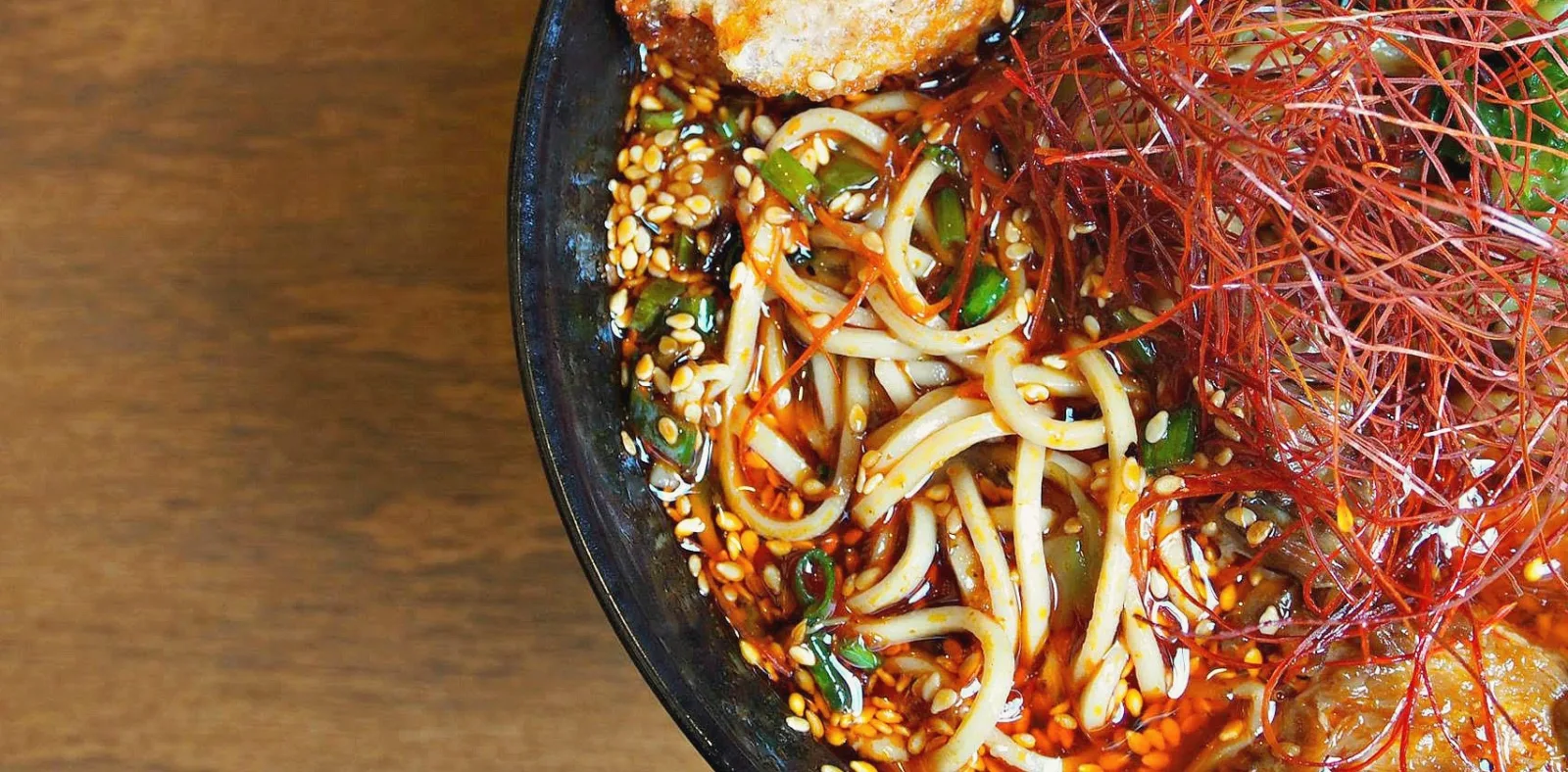 Hell Sauce Cover for Strings Ramen Now Offers Jars of Hell Sauce to Go