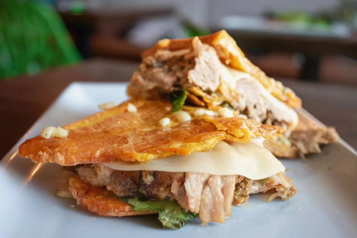 Jibarito De Lechon for Marina's Bistro and Rum Bar Now Open in Uptown