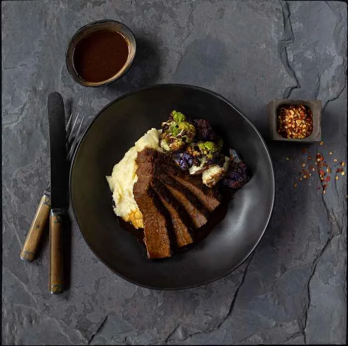 Slow Roasted Brisket Photo By Monica Kass Rogers for Passover To Go on April 22 with Prairie Grass Cafe’s Passover Dinner Package for Two
