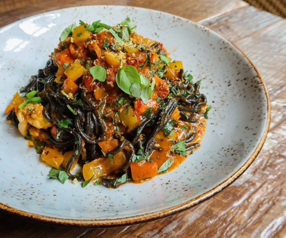 A Moment For Our Squid Ink Spaghetti Please for Where to Eat Your Weight in Carbs During the 2024 Chicago Marathon