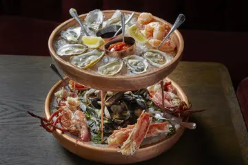 Seafood Tower Courtesy Of Neil Burger for Venteux Celebrates National Oyster Day + Paris Olympics with AYCE Shellfish Party, Oyster Shucking Class, $1 Oysters