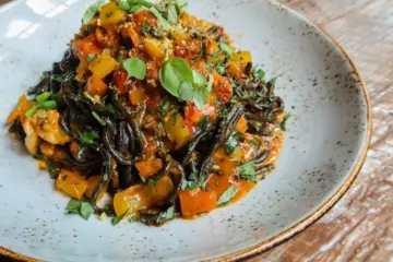 A Moment For Our Squid Ink Spaghetti Please for Where to Eat Your Weight in Carbs During the 2024 Chicago Marathon