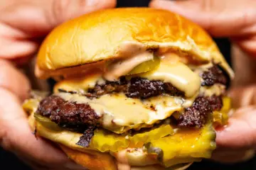 Close Up Nadc Burger for Michelin star Chef and Pro Skateboarder Bring a Second NADC Burger Location to Chicago