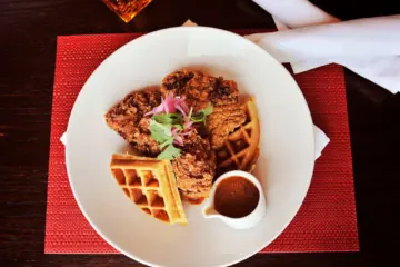 carnivale chicken waffles for Carnivale is Celebrating Sexy With a "50 Shades of Red" Fashion Show Brunch to Kick Off Valentine's Week