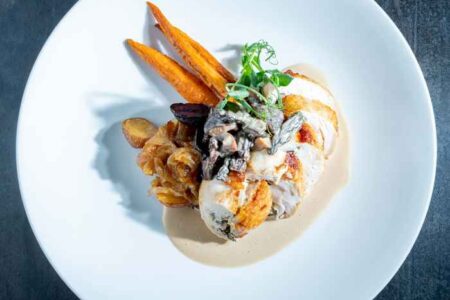 Stuffed Breast Of Hen Mushroom Stuffed Breast Of Hen Duck Fat Potatoes Roasted Baby Carrots Morel Mushroom Sauce for Bastille Day: Where to Wine and Dine on French Fare July 14th