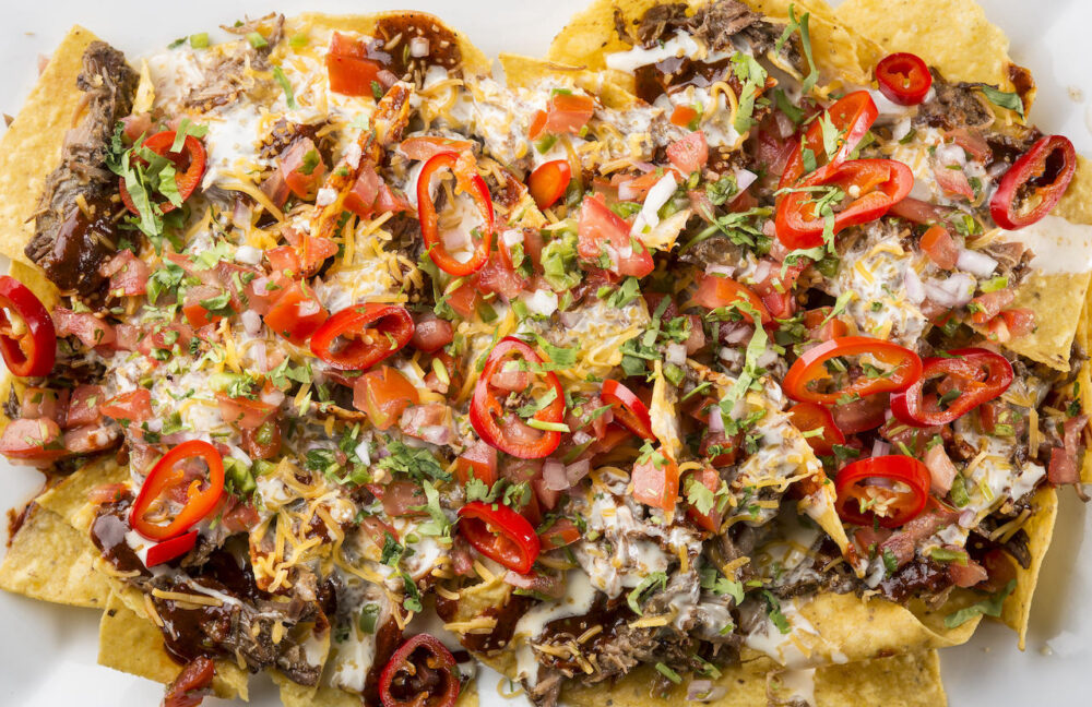 Benchmark's Barbacoa Nachos (Photo courtesy of Marcin Cymmer) for Chicago, Get Ready for the Super Bowl with Catering, Watch Parties and Game Day Snacks Courtesy of Your Favorite Restaurants and Bars