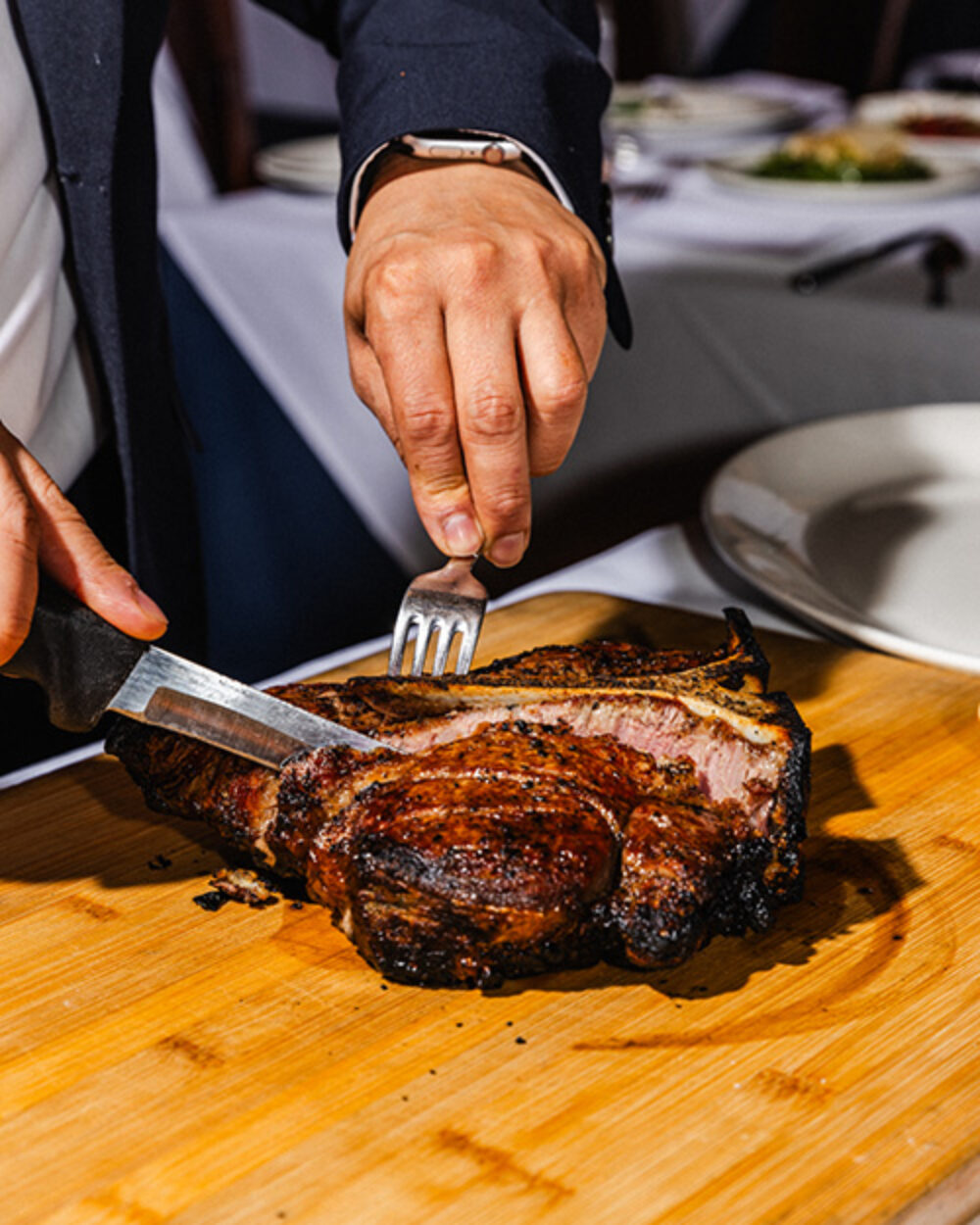 The Bistecca Fiorentina carved tableside. All photo credits: Garrett Sweet for CFM Asks: Jack Weiss and Sam Weiss of Coco Pazzo